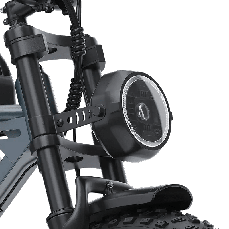 Close-up of electric scooter front suspension and round LED headlight with black frame and thick tire