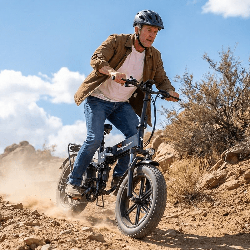 Adult man riding Deepower A5 folding fat tire electric bike on rocky trail