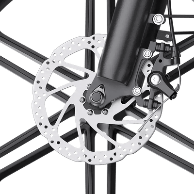 Close-up of a bicycle disc brake with a perforated rotor and black caliper on black spokes