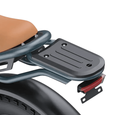 Close-up of black metal rear luggage rack with four mounting holes on electric scooter seat