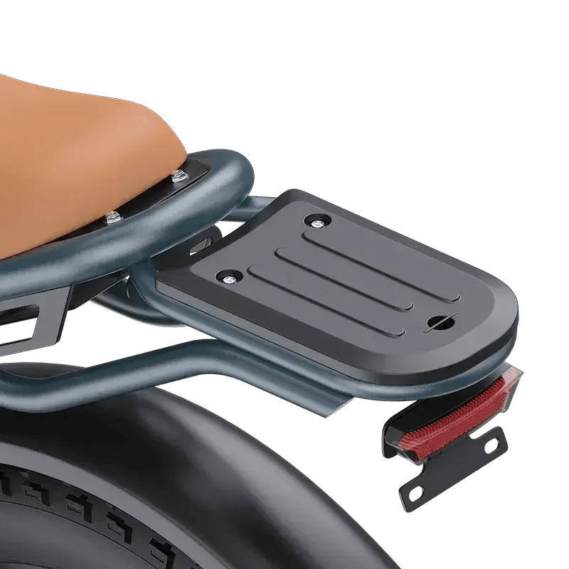 Close-up of black metal rear luggage rack with four mounting holes on electric scooter seat